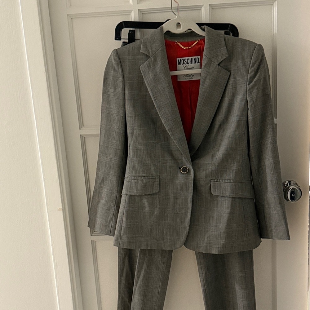 Vintage never been worn Perfect Moschino Charcoal Suit with Red Lining. Size 8